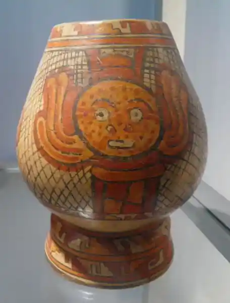 A winged disc with a face